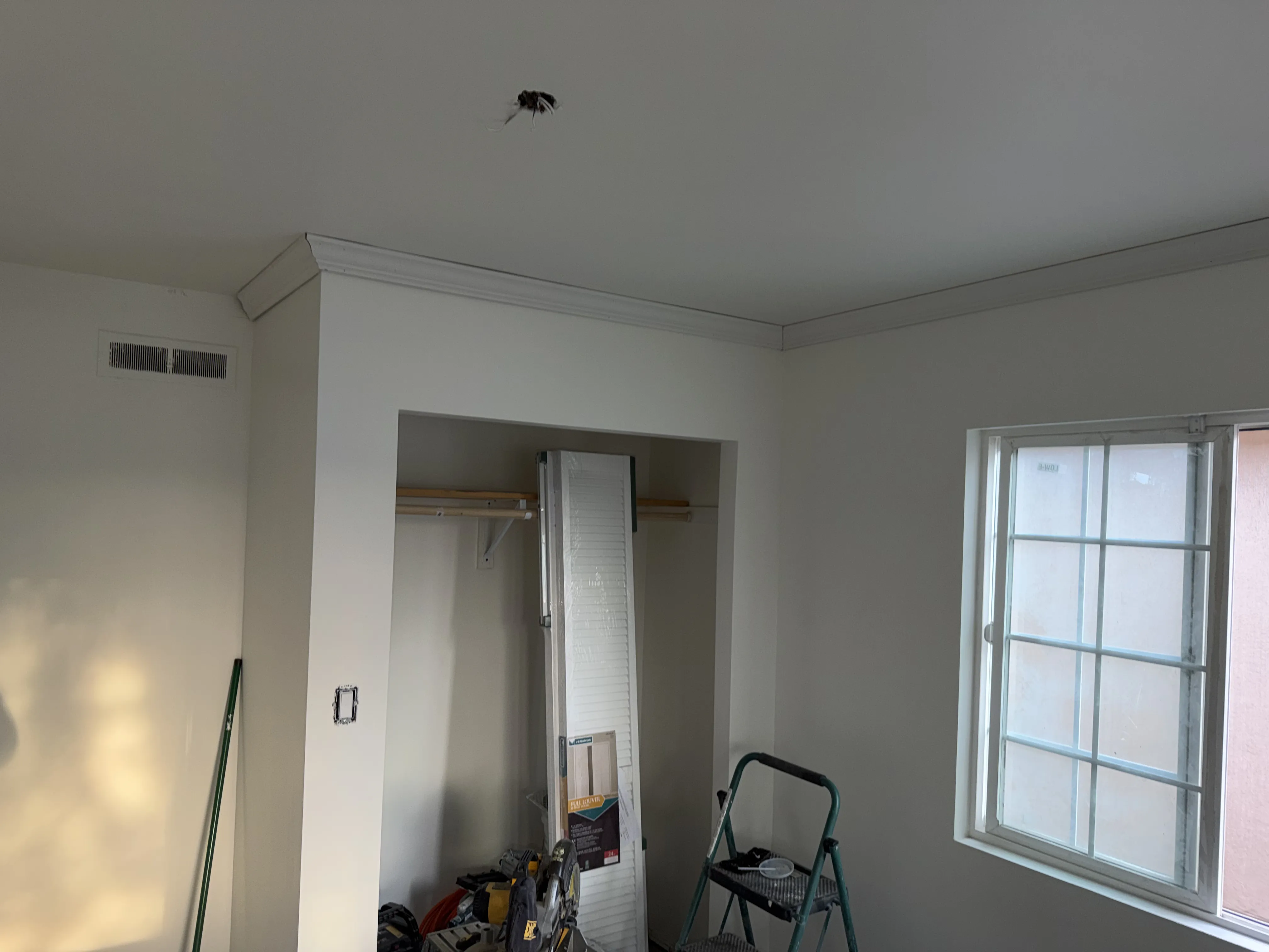 Room with closet and crown molding